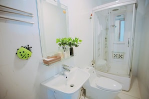Family Room, Non Smoking, Housekeeping | Bathroom | Shower, hair dryer, slippers, towels