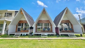 A hotel with three suites, each with a distinct name and a balcony. - Butterfly Bali Glamping (Baturiti)