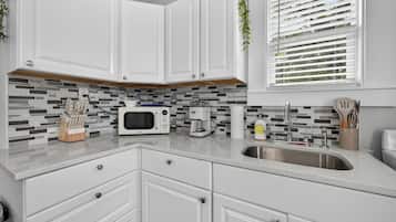 Fridge, microwave, stovetop, coffee/tea maker