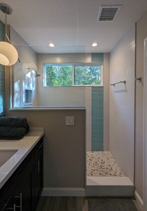 Shower, hair dryer, towels, soap