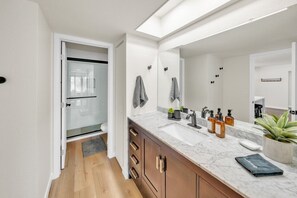 Shower, hair dryer, towels, soap