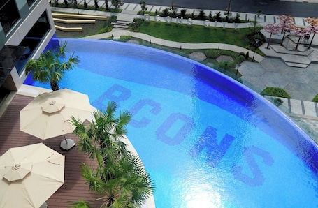 Outdoor pool, open 6:00 AM to 8:00 PM, pool umbrellas. Bcons City Hotel