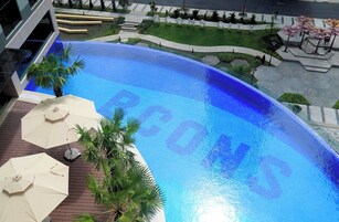 Outdoor pool, open 6:00 AM to 8:00 PM, pool umbrellas