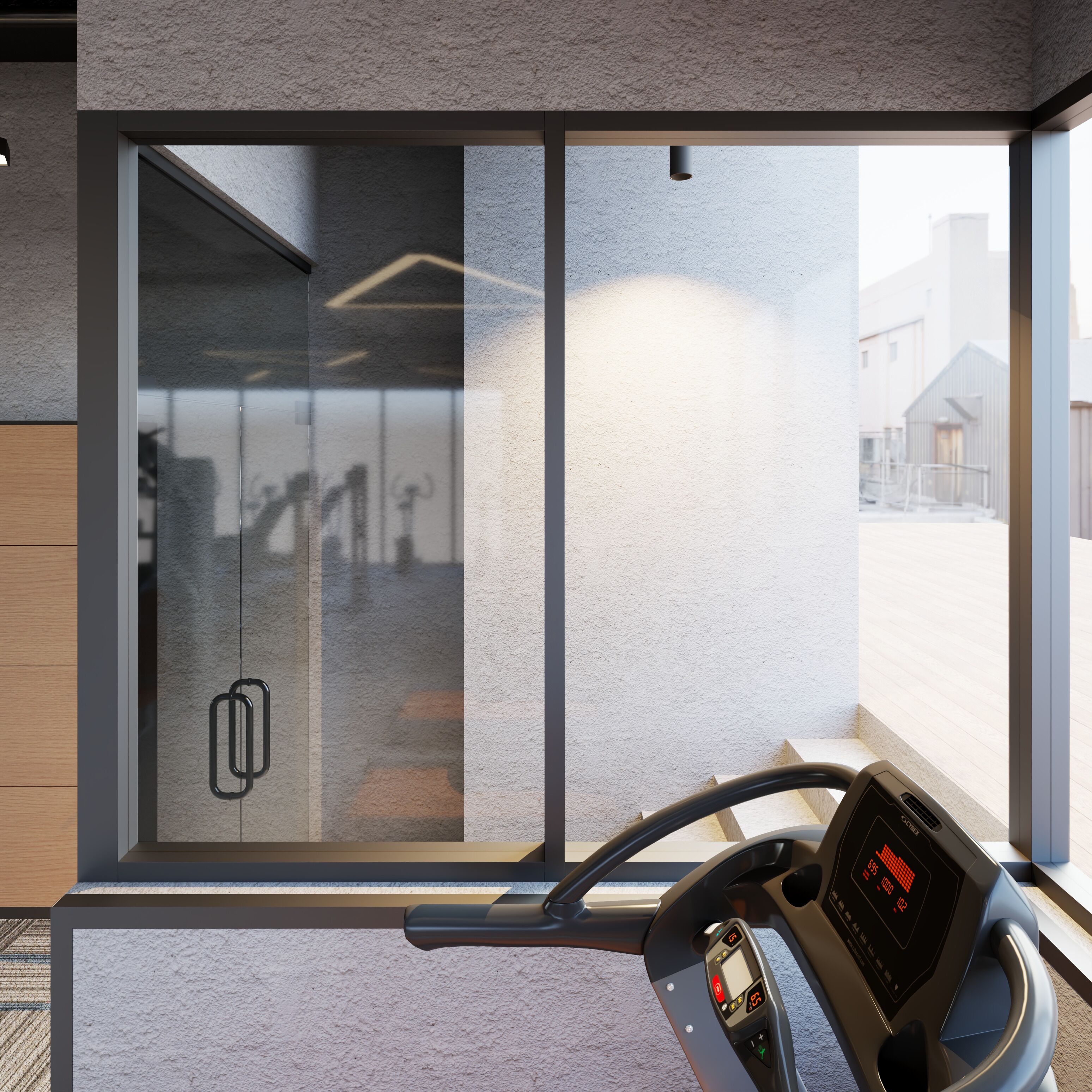 A modern gym with a stationary bike, large windows, and a view of the outside.