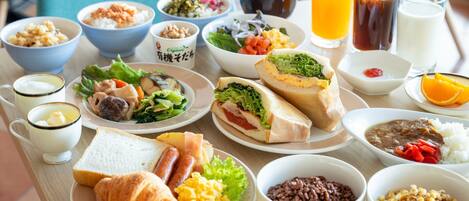 A variety of dishes and beverages on a table.