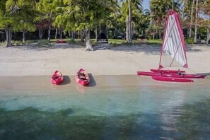 On the beach, sun-loungers