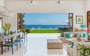 Outdoor dining - Villa Tirta Nila | East Bali 4BR Beachfront | Lagoon Access & Chef (Candidasa)