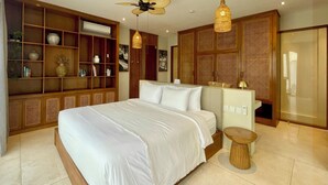 A modern bedroom with a large bed, wooden shelving, a ceiling fan, and a small round table.