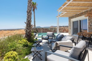 Outdoor dining - Luxury modern 6-person villa with infinity pool and spectacular sea views (Gennadi)