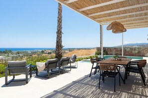 Outdoor dining - Luxury modern 6-person villa with infinity pool and spectacular sea views (Gennadi)