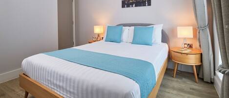 Appartamento Comfort, 2 camere da letto, bagno privato, vista città | Cassaforte in camera, tende oscuranti, ferro/asse da stiro