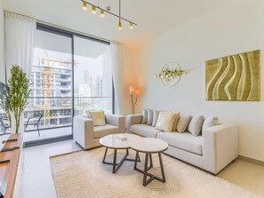 Deluxe Apartment, Balcony, City View | Living area | 55-inch Smart TV with digital channels