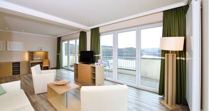 Spacious double suite with balcony and lake view
