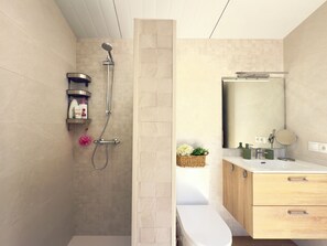 Shower, hair dryer, towels, toilet paper
