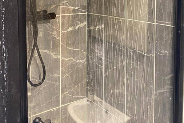Shower, deep soaking tub, towels
