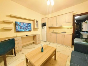Standard Studio, 1 Bedroom | Living area | 44-inch LED TV with satellite channels, Netflix, streaming services