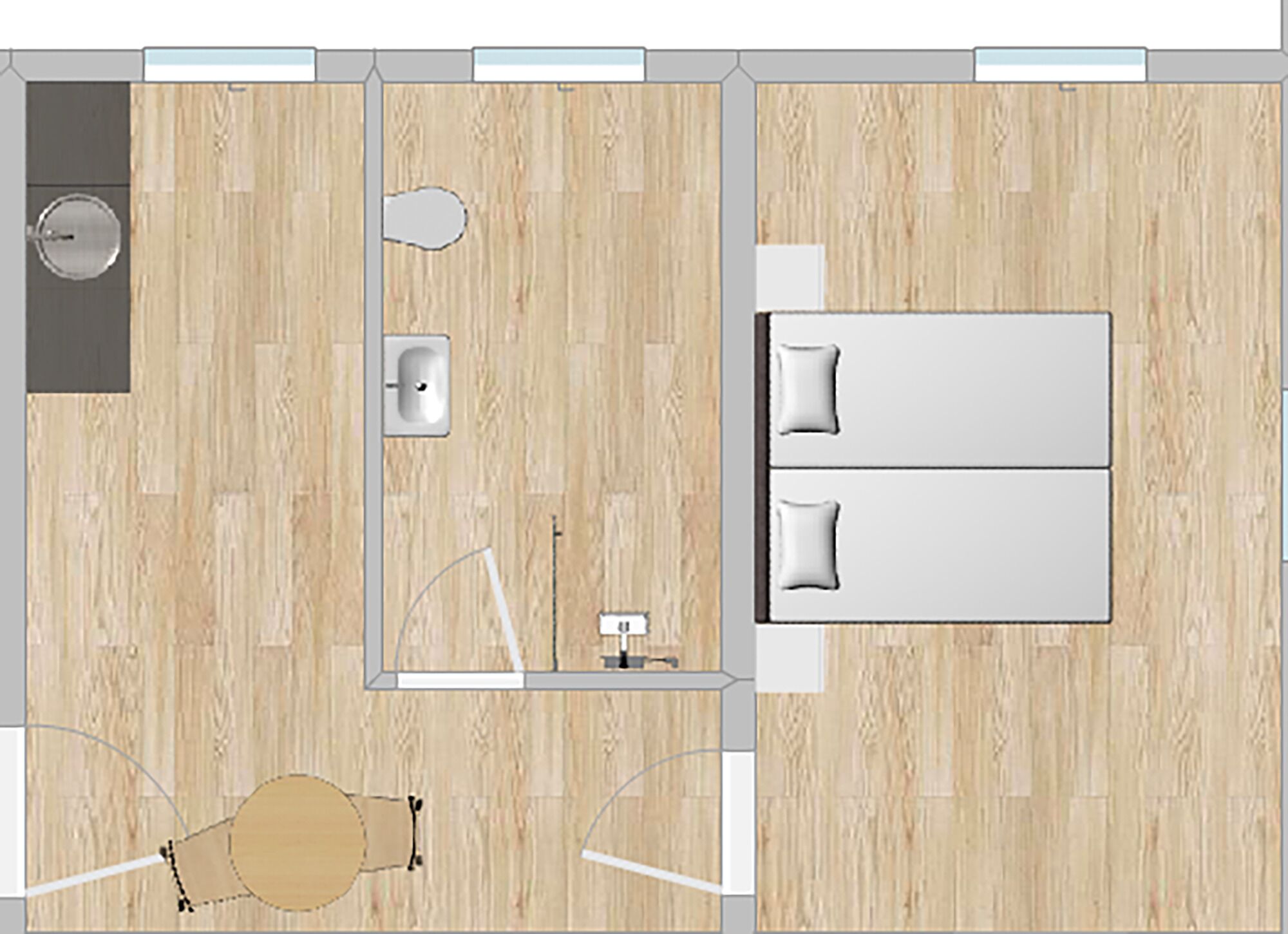 A kitchen with a sink, stove, and countertop. There is a dining area with a table and chairs.