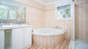 Separate tub and shower, deep soaking tub, hair dryer, towels