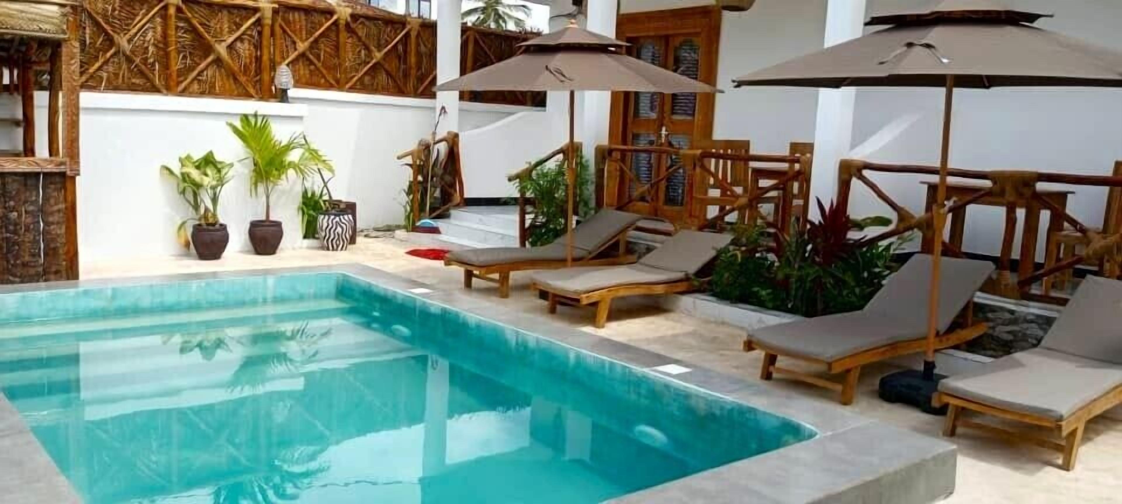 Outdoor pool, open 8:00 AM to 10:00 PM, pool umbrellas, sun loungers