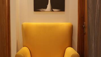 Deluxe Apartment | Living area | 31-inch LCD TV with cable channels