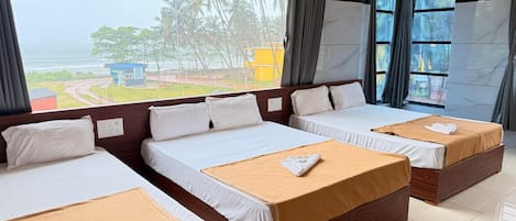 Chambre double ou avec lits jumeaux, vue sur la baie | Aire de séjour