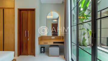 Premium bedding, desk, laptop workspace, iron/ironing board