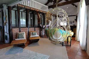Deluxe Loft, 1 Bedroom, Kitchenette, Garden View | Living area | Flat-screen TV