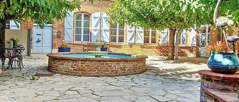 Deluxe Suite, Patio, Garden View | Terrace/patio