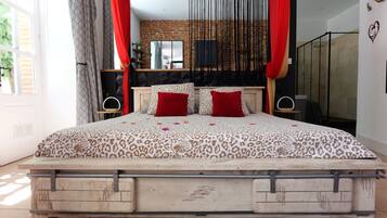 Deluxe Suite, Patio, Garden View | In-room safe, blackout drapes, soundproofing, free WiFi