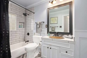 Shower, hair dryer, towels, shampoo
