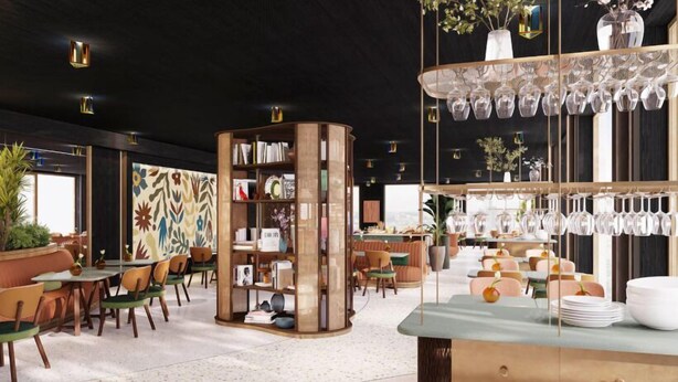 Un intérieur moderne avec une bibliothèque centrale, des tables accompagnées de chaises et des éléments de décoration en verre suspendus.