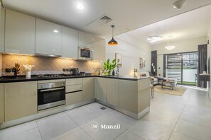 Luxury Apartment, Balcony, Pool View | Private kitchenette