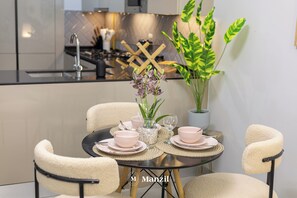 Dining - Manzil-Stylish 1BR with Maid room in JVC (Dubai)