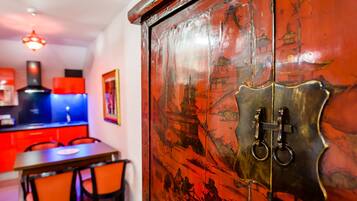 A traditional wooden cabinet with intricate carvings and a brass lock mechanism.