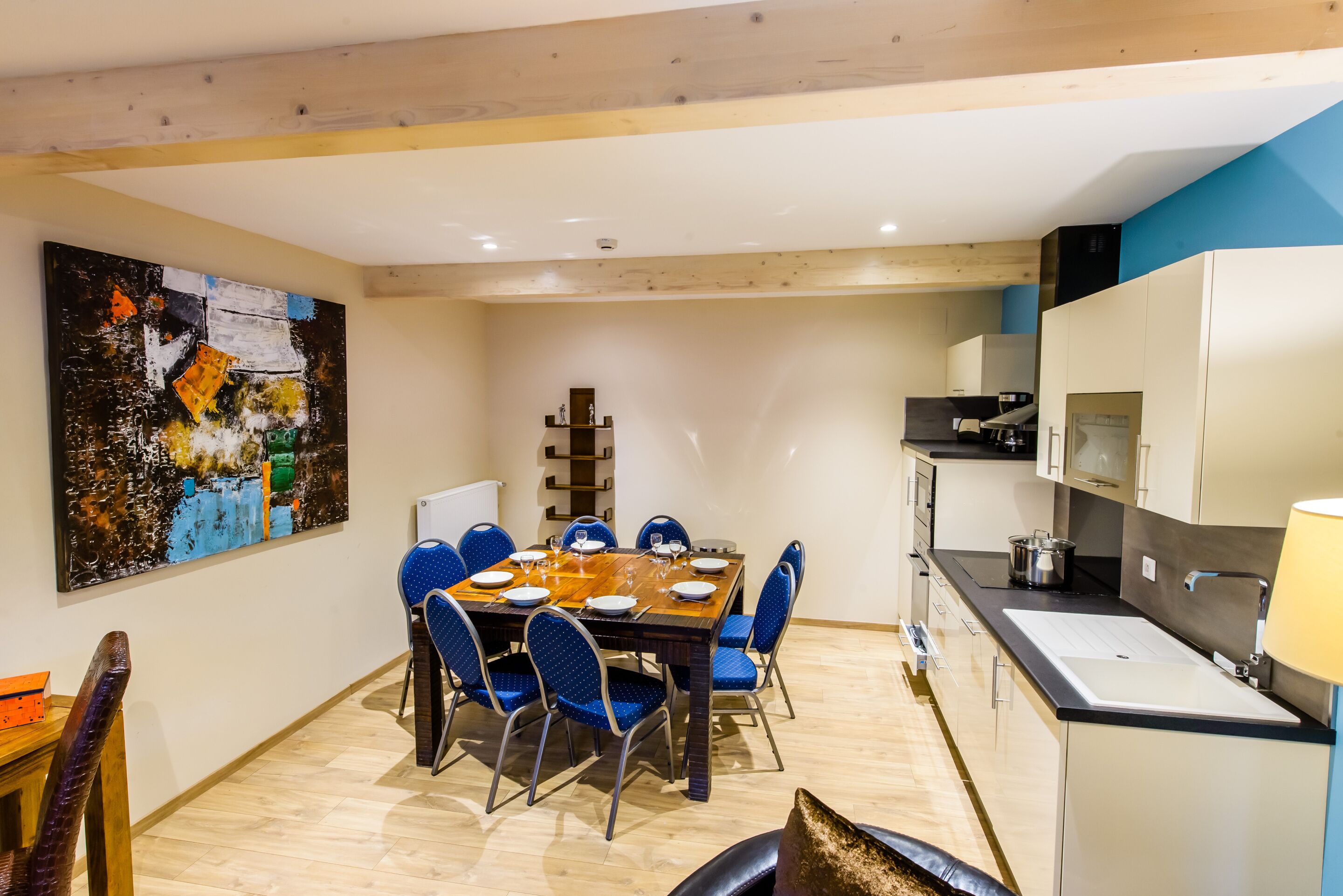 A modern kitchen with a dining area.