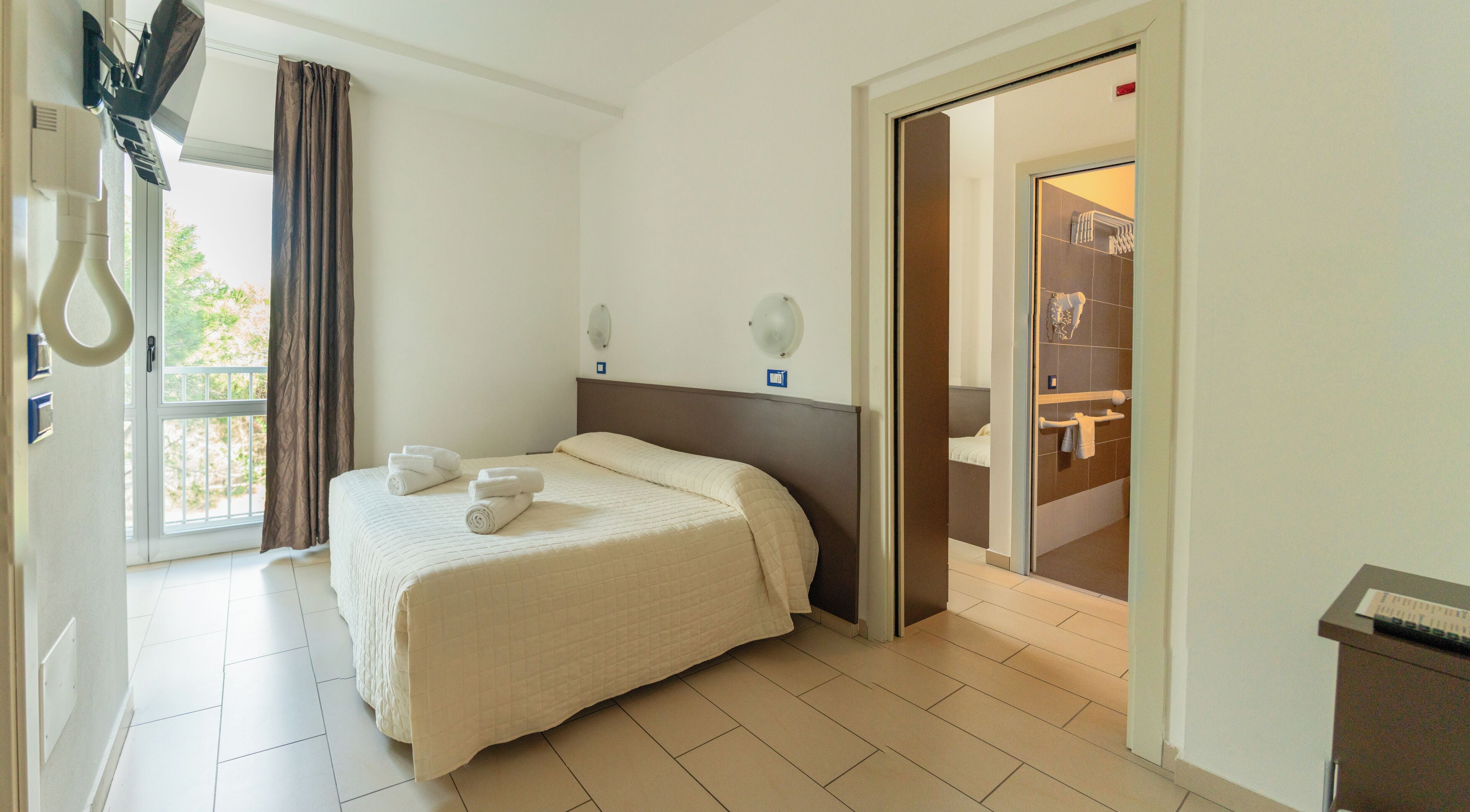 Family Room | Premium bedding, down duvets, in-room safe, desk