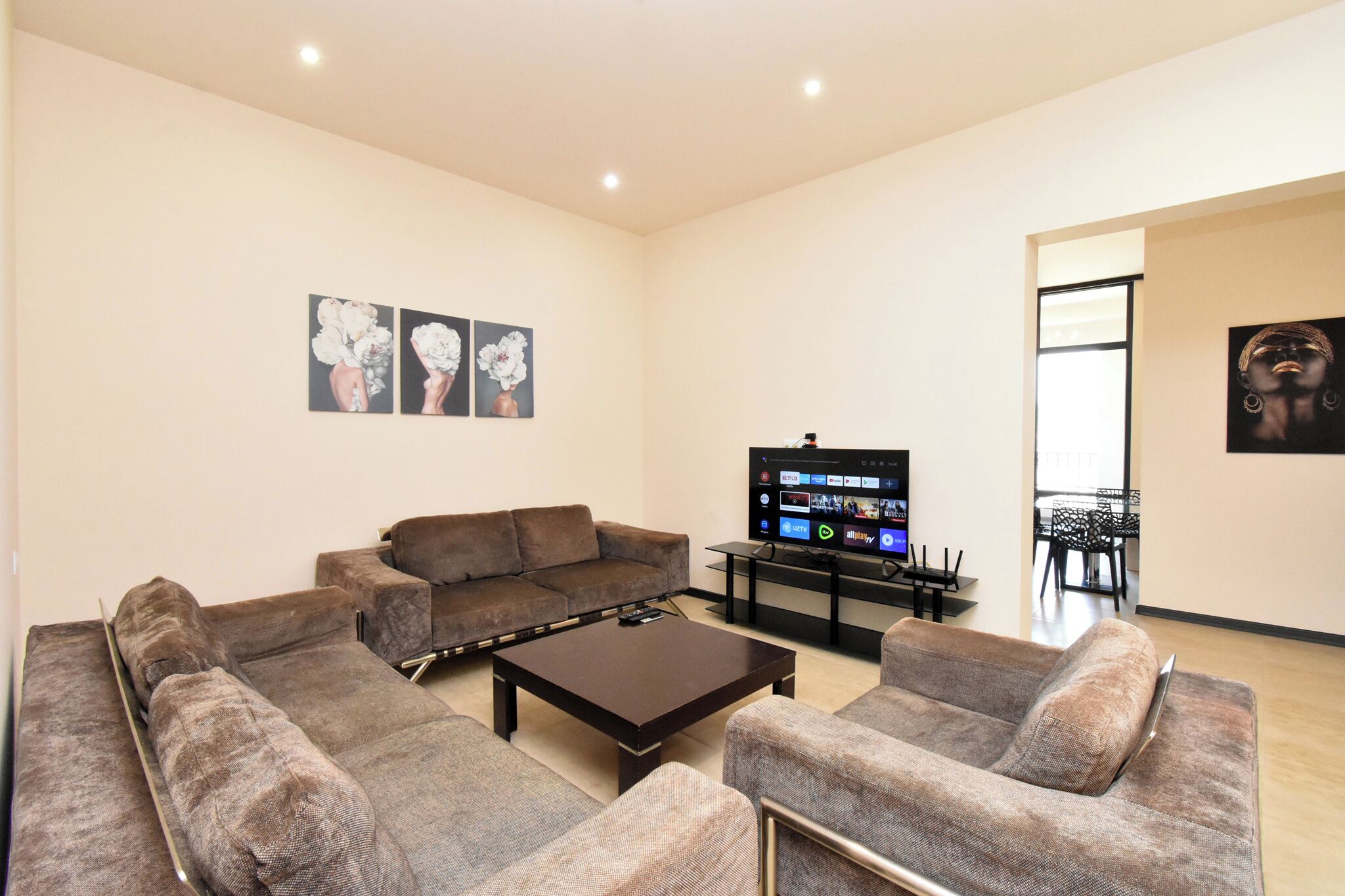 Family Apartment, Balcony, City View | Living area | 50-inch flat-screen TV with cable channels