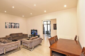 Family Apartment, Balcony, City View | Living area | 50-inch flat-screen TV with cable channels - Apartments by Luxe Group DI64 (Yerevan)