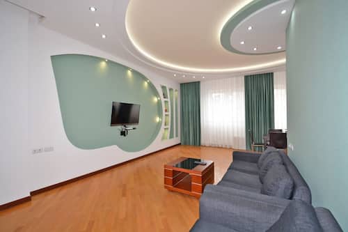 Comfort Apartment, City View | Living area | 50-inch flat-screen TV with cable channels