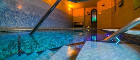 Indoor pool, open 8:00 AM to 10:00 PM, pool loungers