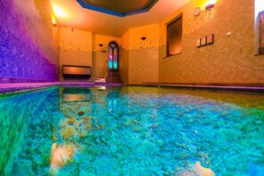 Indoor pool, open 8:00 AM to 10:00 PM, pool loungers