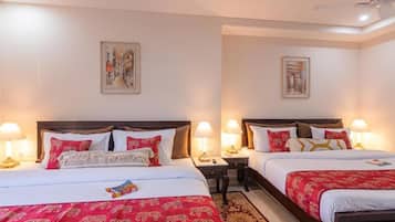 Family Quadruple Room, City View | Desk, laptop workspace, WiFi (free), bed sheets