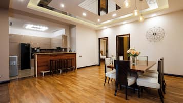 Luxury Apartment | Living area | 50-inch flat-screen TV with cable channels
