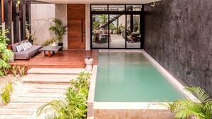 A modern house with a rooftop garden, a swimming pool, and a patio area with outdoor furniture. - Anana Casa Karmond Luxury Villa With Pool (Tulum)