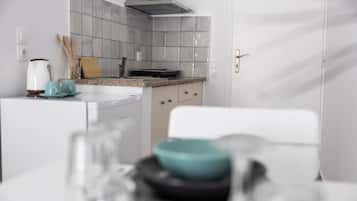 Fridge, stovetop, electric kettle, cookware/dishes/utensils