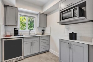 Fridge, microwave, stovetop, coffee/tea maker