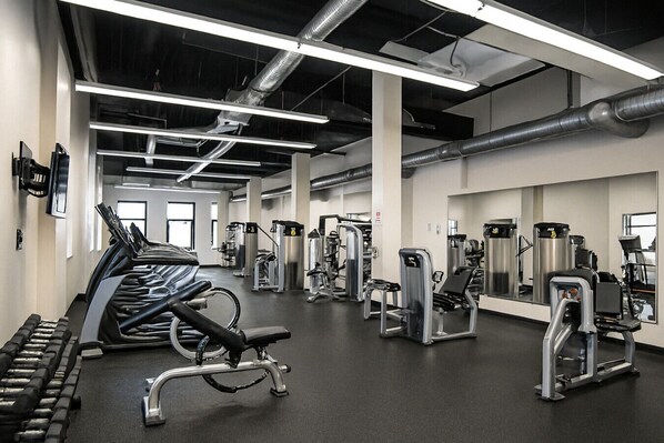 A gym with treadmills, weight machines, and free weights. - Dwntwn Sq! Stadium, Casino, RnR, CSU, Clinic, CSU (Cleveland)
