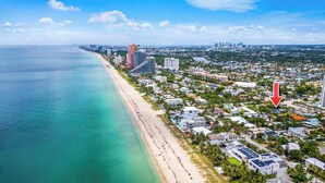 An aerial view of a coastal city with a beach, high-rise buildings, and a mix of residential and commercial areas. - Beach Pop - Steps to Beach, Heated Pool & Hot Tub (Fort Lauderdale)