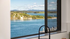 A view of a river with a bridge and hills in the distance. - Lago Vista on the Forster lakefront (Forster)