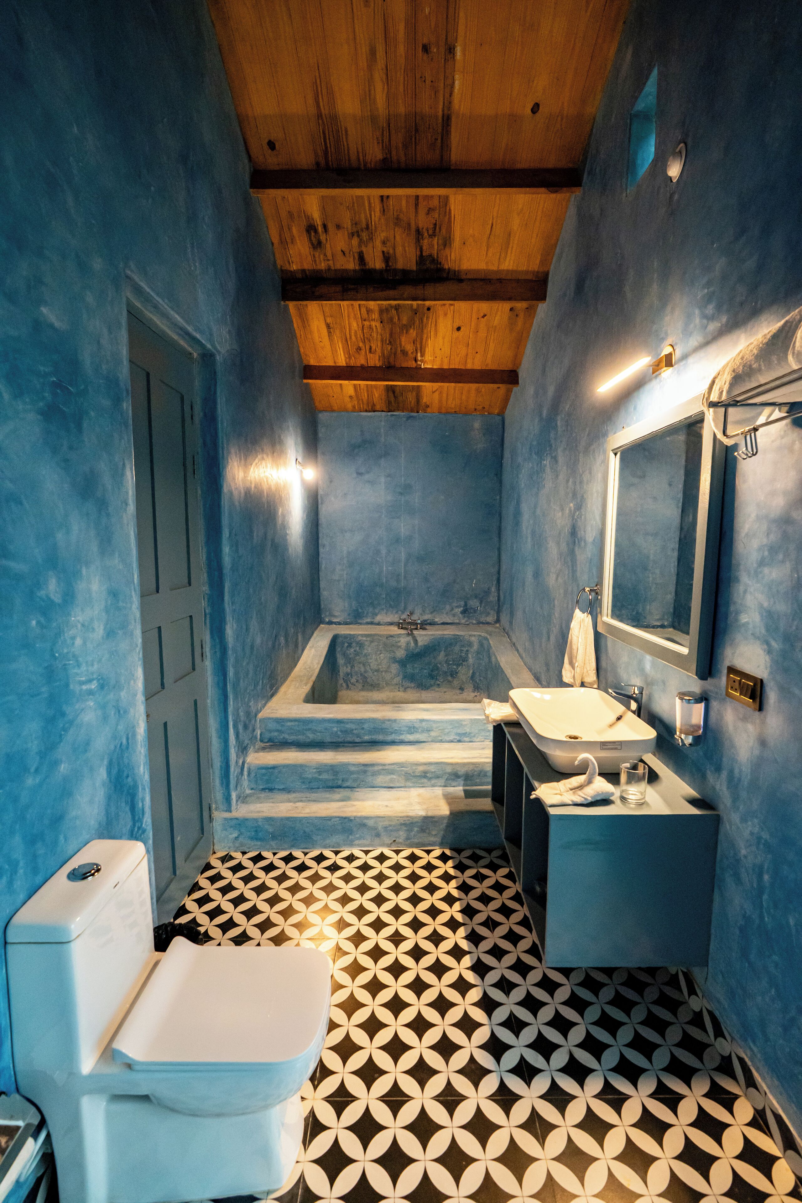 A bathroom with a bathtub, toilet, and sink.